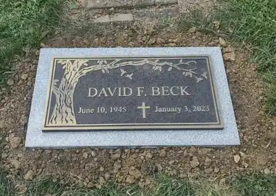 Beck bronze memorial plaque on granite
