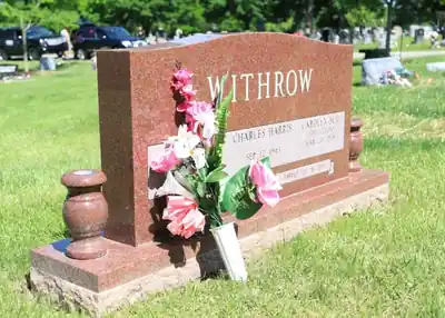 Withrow red granite monument installed in cemetery